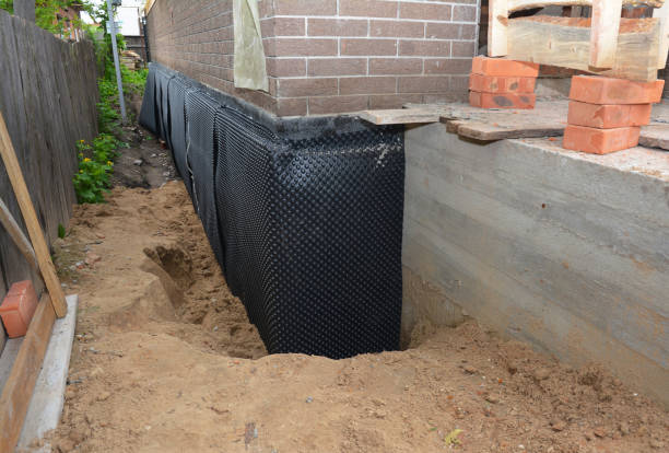 SJ Waterproofing Pros technician performing targeted Interior Drainage System assessment in Farmingdale, NJ